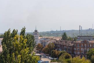 город