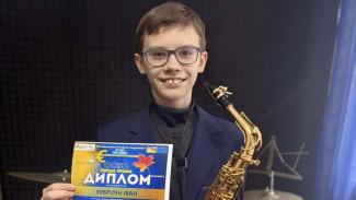 учень